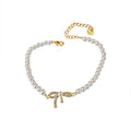 White Pearl Bracelet With Gold Tone Crystal Bow Center view 5