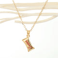 Gold Tone Artist Palette and Sweet Wrapper Pendant Necklaces view 4