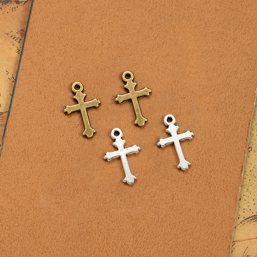 Simple cross charm components displayed in multiple metal finishes