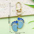 Baby Shower Charm Keychains Featuring Blue Lollipop Bottle Across 14 Pictured Variations view 12
