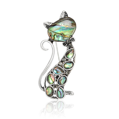 Front view of slender seated cat filled with iridescent teardrop inlays