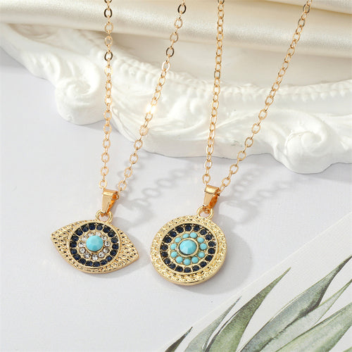 Gold round and almond evil eye pendant necklaces with turquoise centers side by side