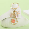 Starfish, Conch and Shell Charm Keychains Featuring Pink Starfish Across 59 Variations view 1