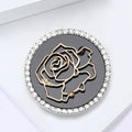 Round Rose Brooch In Metal With A Black Enamel Field, Gold-Tone Rose Outline, And Crystal view 4