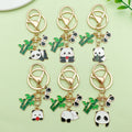 Panda Charm Keychains Featuring White Flower Across 45 Pictured Variations view 1