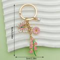 Rose, Sunflower and Flower Charm Keychains Featuring Purple Butterfly Across 50 Variations view 9