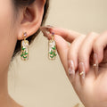 Green Bamboo Leaf and White Flower Gold Tone Dangle Earrings view 1