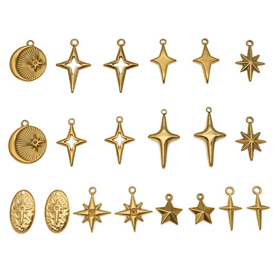 Gold-tone cross charms arranged on a light background