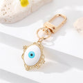Gold Tone Filigree Oval Teardrop and Star Evil Eye Clip Keychains view 10