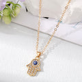 Gold and Silver Tone Crystal Evil Eye and Hamsa Necklaces view 3