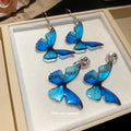Blue Butterfly Drop Earrings in Clip On and Hook Styles view 4