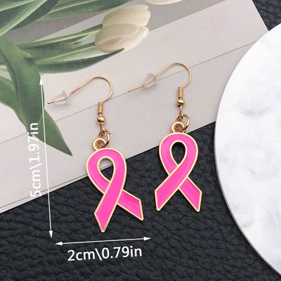 Front product photo of pink awareness ribbon dangle hook earring pair with metal hooks showing the pictured design arran