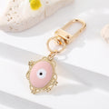 Gold Tone Filigree Oval Teardrop and Star Evil Eye Clip Keychains view 4
