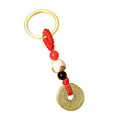 Metal Coin Keychain With Red Cord and Red, White and Black Beads view 5