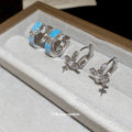Silver Tone Cross Charm Huggie Hoops In Two Styles view 1