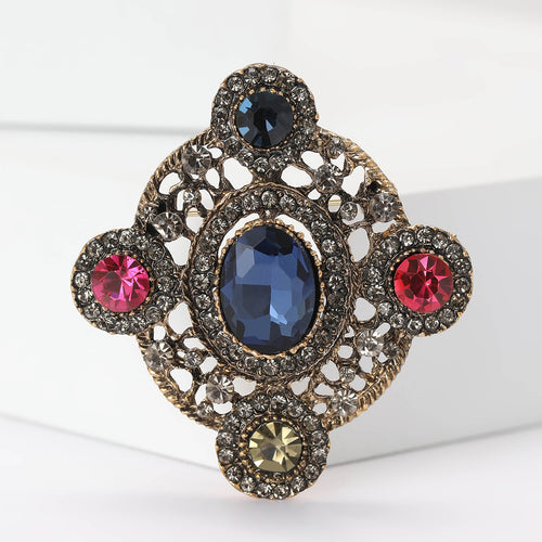 Blue oval center antique gold baroque brooch front close-up