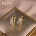 Gold Pave Crystal Leaf Shaped Huggie Hoop Earrings view 1