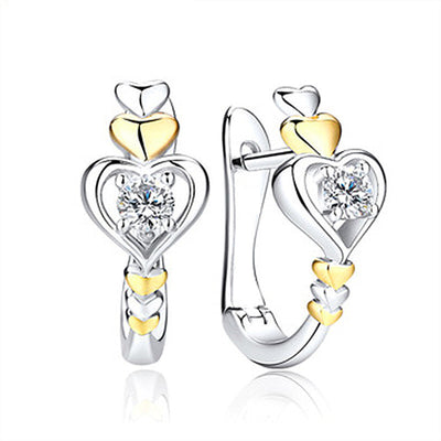 Two-tone silver gold heart huggie earrings front and side view