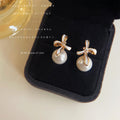 Gold White Enamel Bow Pearl Drop Stud Earrings Clear Stone view 1