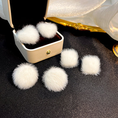 Primary supplied view of white fuzzy pom-pom stud earrings