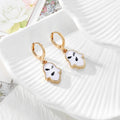 Gold Tone Pressed Flower Hamsa Huggie Earrings in Nine Options view 4