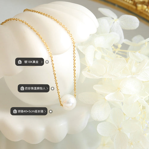 Gold pearl necklace flat lay with plating, faux pearl, length labels