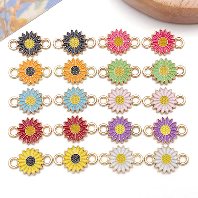 Colorful daisy and sun charms arranged on a light background