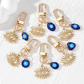 Gold Tone Open Lash Eye and Blue Evil Eye Clip Keychains view 1