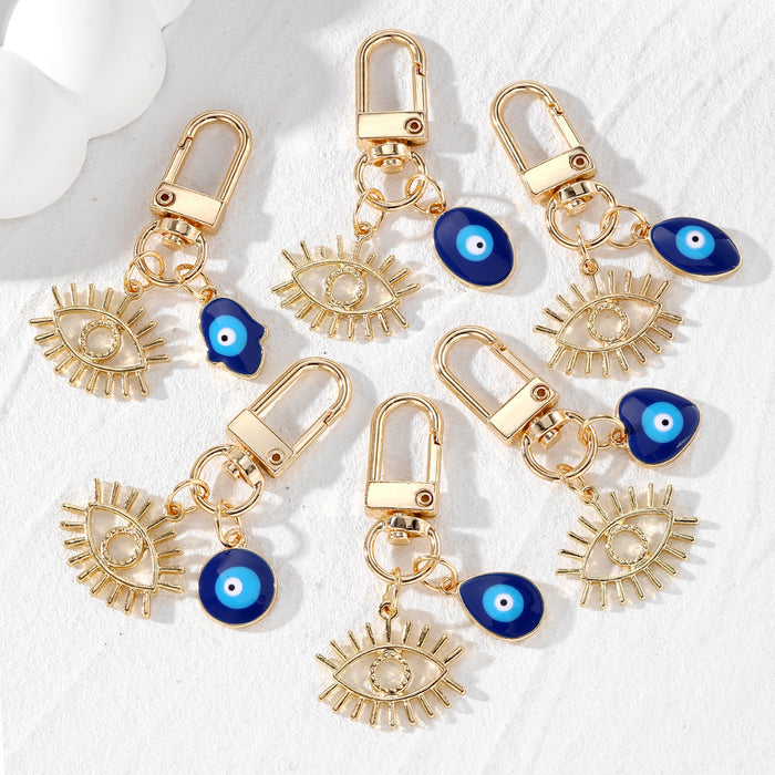 Gold Tone Open Lash Eye and Blue Evil Eye Clip Keychains
