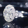 Silver Tone Oval Halo Ring With Clear Side Stones Polished Jewelry view 2