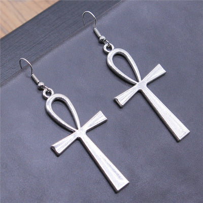 Hand held view of ankh earrings
