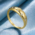 Star And Clear Stone Domed Band Ring In Polished Gold Tone view 1