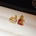 Red Enamel and Crystal Double Heart Huggie Earrings view 1