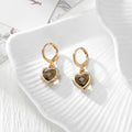 Gold Tone Faceted Crystal Heart Huggie Earrings in Eleven Color Options view 9
