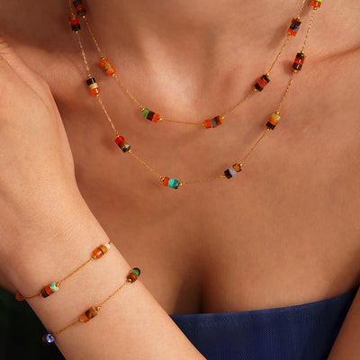 Model wearing multicolor natural stone bead necklace and bracelet set
