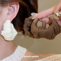 Knitted Yarn Twist Hoop Earrings In Brown And Ivory view 1