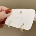 Pearl Trim Mini Hoop Earrings in Silver and Gold Tone view 7