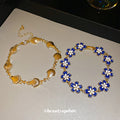 Gold Tone Blue Flower Bracelet And Unrelated Scallop Link Bracelet view 2