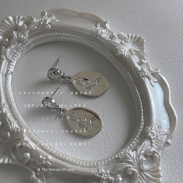 Silver-Tone Embossed Rose Oval Pendant Drop Earrings