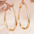 Brass Gold-Tone Twisted Teardrop Hoop Earrings in Three Sizes view 6