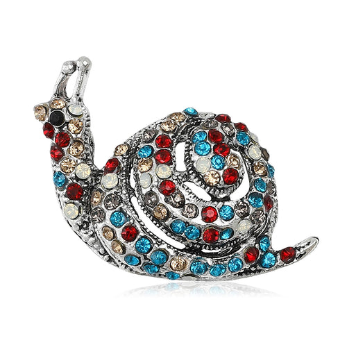 Front view of a silver-tone snail covered with red blue and clear crystals