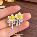 White Floral Dangle Stud Earrings in Two Daisy Styles view 4