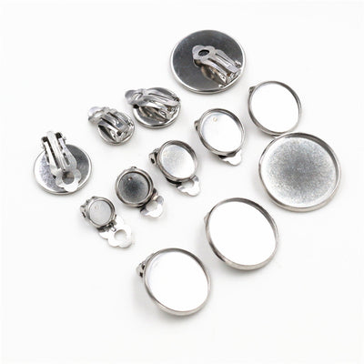 圆底托无耳洞耳夹胚 displayed assortment on a white background