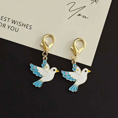 Main product view of white Flying Dove Lobster-Clasp Charm with Blue Wings