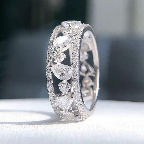Open Heart and Round Stone Eternity Style Band Ring shown in product close-up