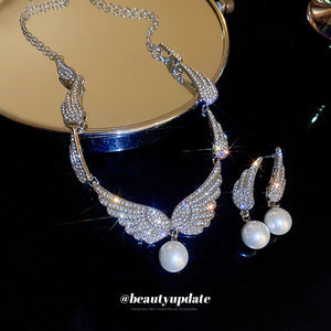 Silver Tone Crystal Wing Earrings And Necklace With Pearl Drops
