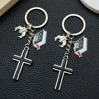 Main display of black and silver cross bat skull charm keychains