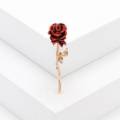 Red enamel rose brooch gold stem on white steps