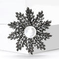 Pearl Snowflake Brooch in Metal with Radiating Crystal Branches Around a White Pearl view 4