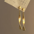 Matte Wavy Ribbon Drop Stud Earrings in Gold and Silver view 6